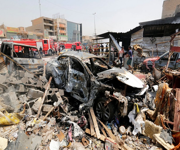 A destroyed car is seen at the site of a car bomb attack in Jamila market in Sadr City district of Baghdad, Iraq August 28, 2017. REUTERS/Wissm al-Okili