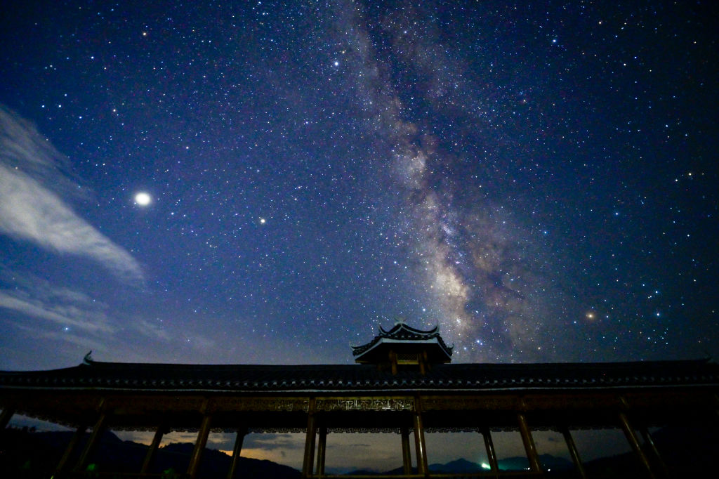 CONGJIANG, CHINA - AUGUST 12, 2021 - Photo taken on Aug. 12, 2021 shows the Perseid meteor shower over Miao Village in Congjiang County, Southwest China's Guizhou Province. (Photo credit should read Costfoto/Future Publishing via Getty Images)