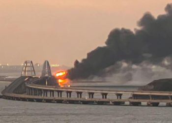 A view shows a fire on the Kerch bridge at sunrise in the Kerch Strait, Crimea, October 8, 2022. REUTERS/Stringer