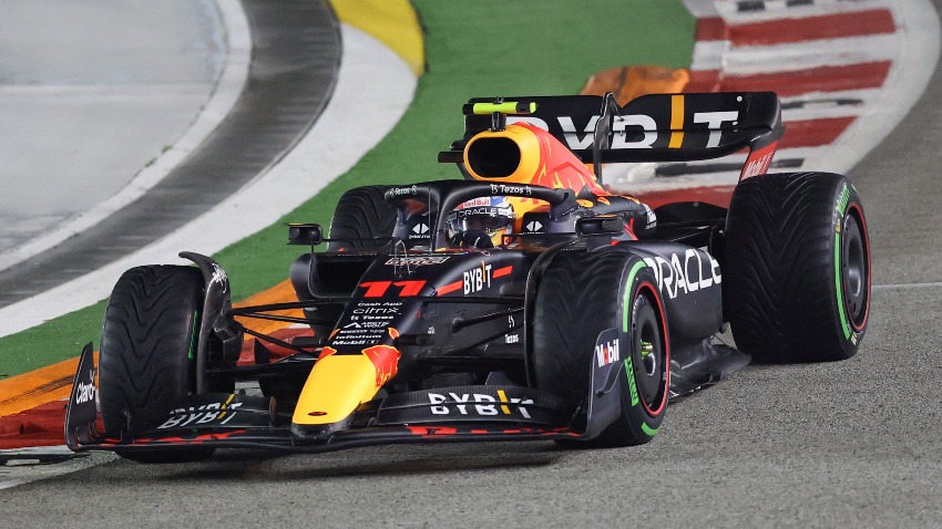 Red Bull driver Sergio Perez of Mexico steers his car during the Singapore Formula One Grand Prix, at the Marina Bay City Circuit in Singapore, Sunday, Oct.2, 2022. (AP Photo/Danial Hakim)